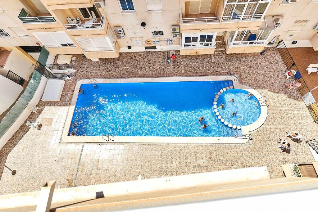 an overhead view of a swimming pool in a building at Espanhouse David 2 bedroom apartment Torrevieja with pool in Torrevieja
