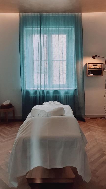 Postel nebo postele na pokoji v ubytování Boutique & Design Hotel AUERSPERG