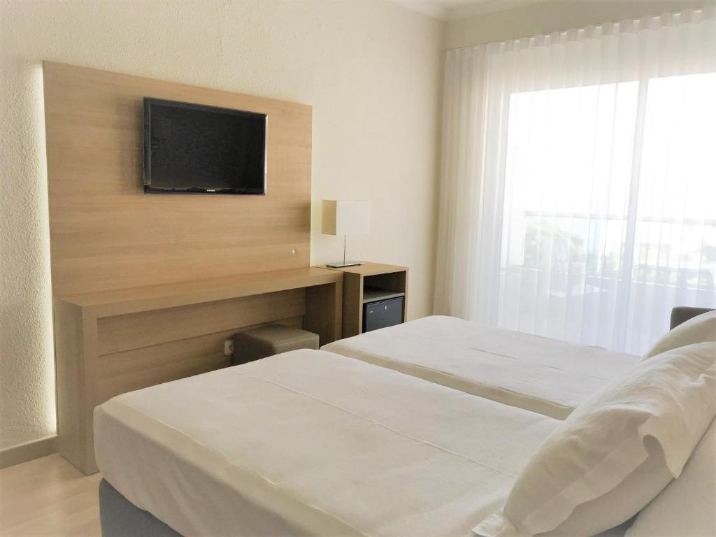 Postel nebo postele na pokoji v ubytování Hotel Las Vegas