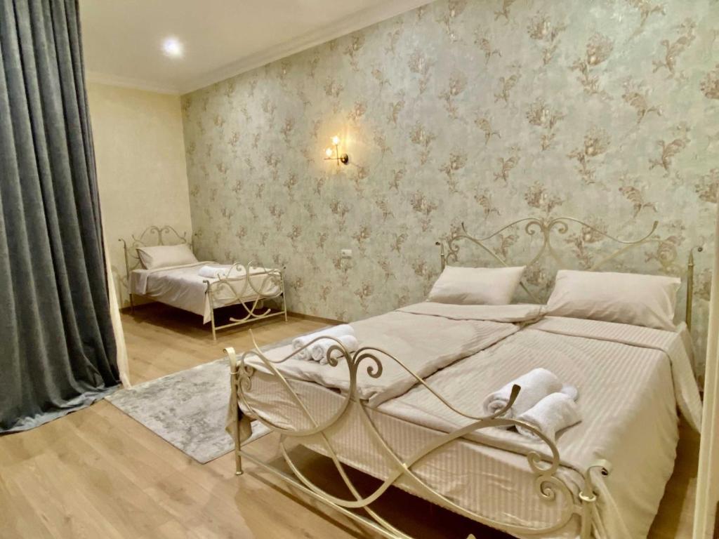 Postel nebo postele na pokoji v ubytování Hotel Late