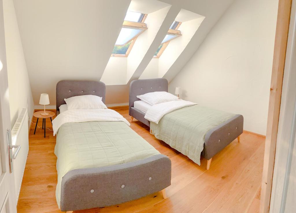 A bed or beds in a room at Superb Mýto Apartment