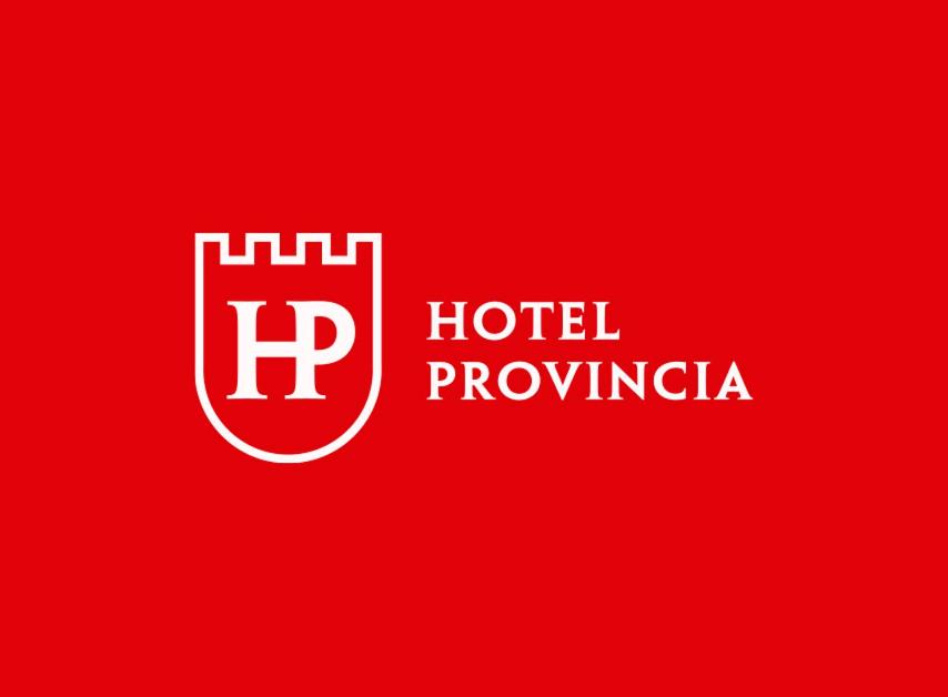 a red sign with a red shield and the words hotel throwingida at Hotel Provincia in Trelew