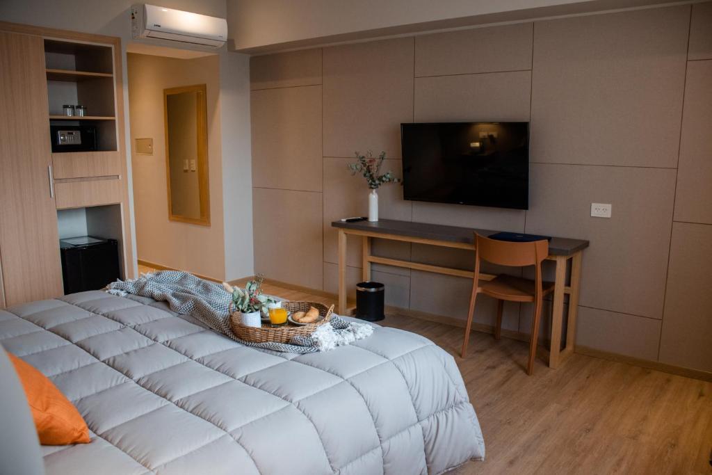 TV a/nebo společenská místnost v ubytování Gran Hotel Dakar