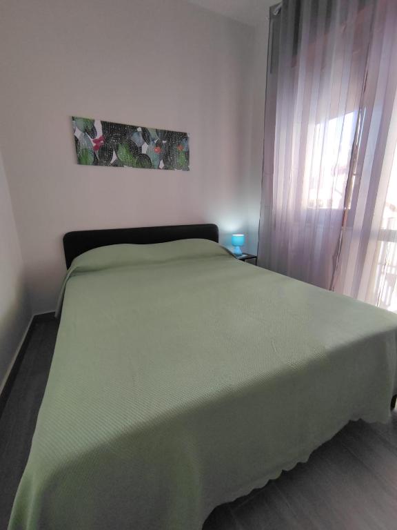 Łóżko lub łóżka w pokoju w obiekcie La Casa In Riva Al Mare