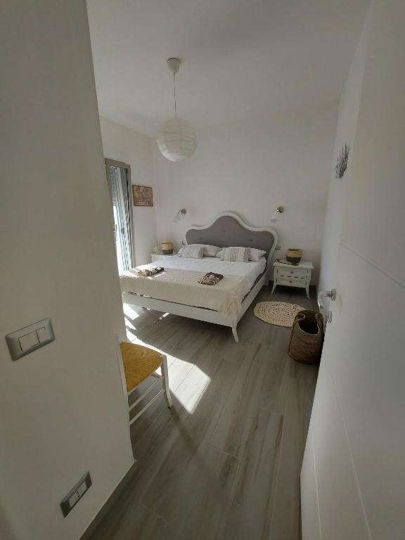 Łóżko lub łóżka w pokoju w obiekcie Villa Sara