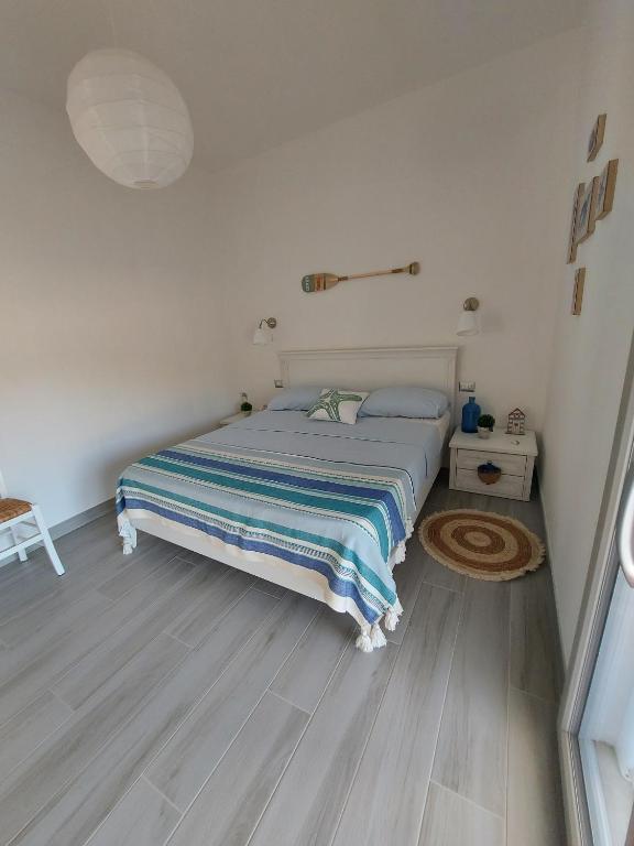 Łóżko lub łóżka w pokoju w obiekcie Villa Sara