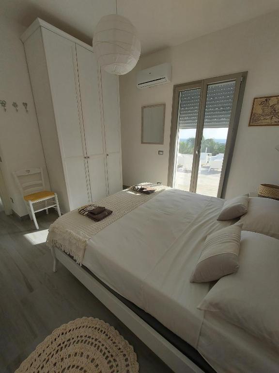 Łóżko lub łóżka w pokoju w obiekcie Villa Sara