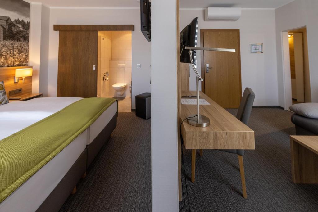 Postel nebo postele na pokoji v ubytování Hotel Rose
