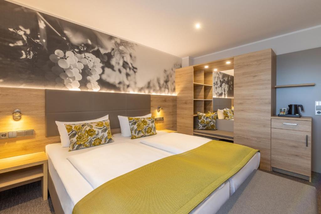 Postel nebo postele na pokoji v ubytování Hotel Rose