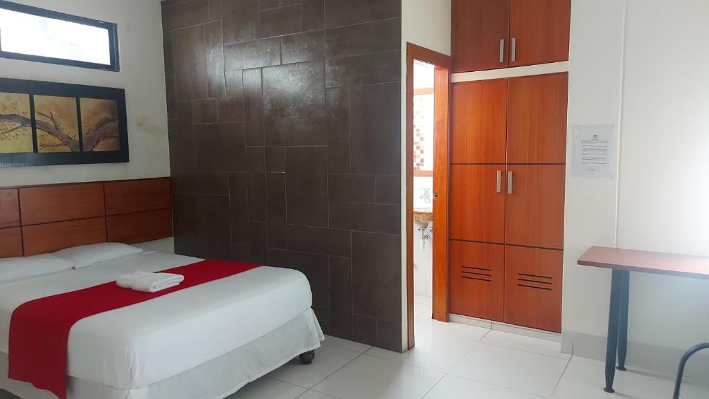 Postel nebo postele na pokoji v ubytování Hotel Murali - Cerca del Aeropuerto de Guayaquil