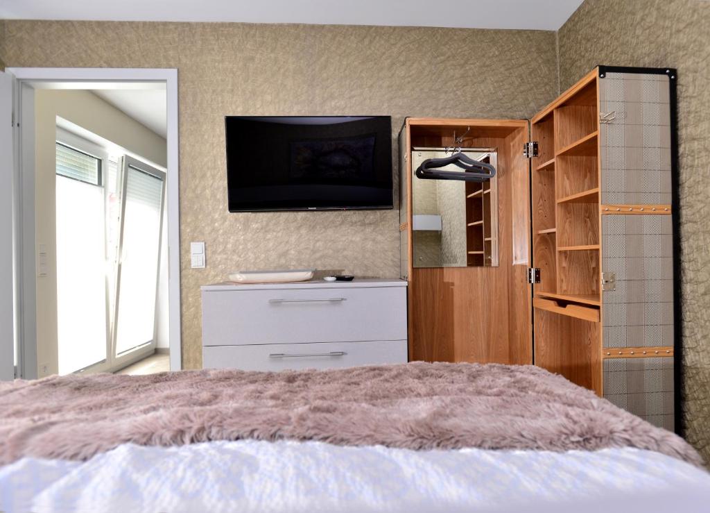 Postel nebo postele na pokoji v ubytování Aparthotel-Stadtallendorf