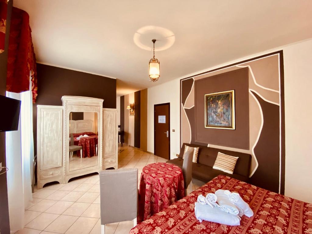 Postel nebo postele na pokoji v ubytování Art Hotel Pandos