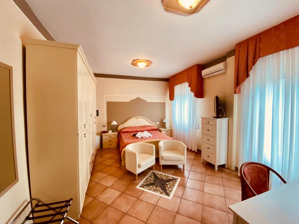 Postel nebo postele na pokoji v ubytování Art Hotel Pandos