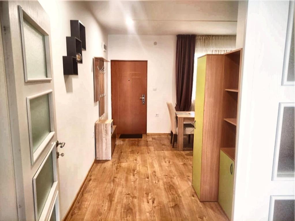 an empty room with a door and a wooden floor at Villa Bambooka in Bar