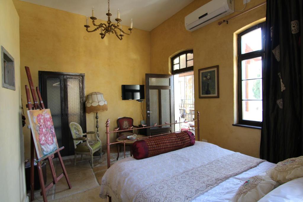 Postel nebo postele na pokoji v ubytování Atelier Luxury Rooms