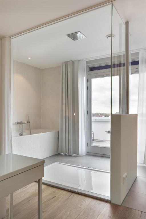 Postel nebo postele na pokoji v ubytování Vesper Hotel