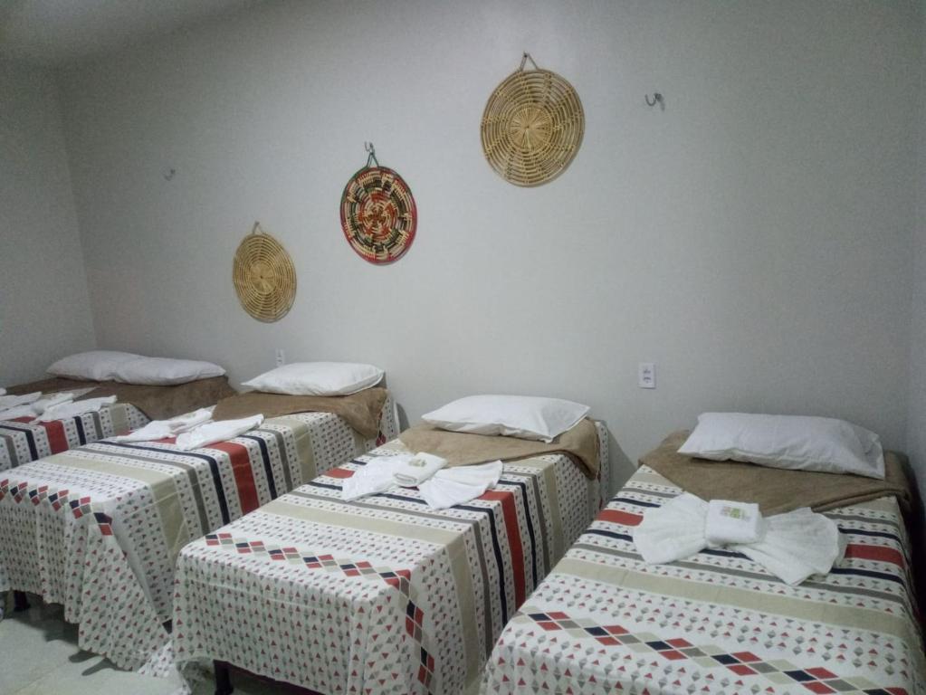 Postel nebo postele na pokoji v ubytování Pousada Aconchego Santarém