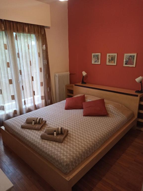 a bedroom with a bed with two towels on it at A&F ioannina apartment in Ioannina