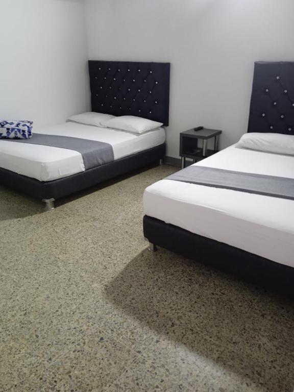 Postel nebo postele na pokoji v ubytování Hotel Urbano 70