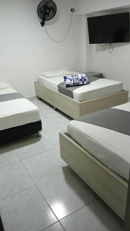 Postel nebo postele na pokoji v ubytování Hotel Urbano 70