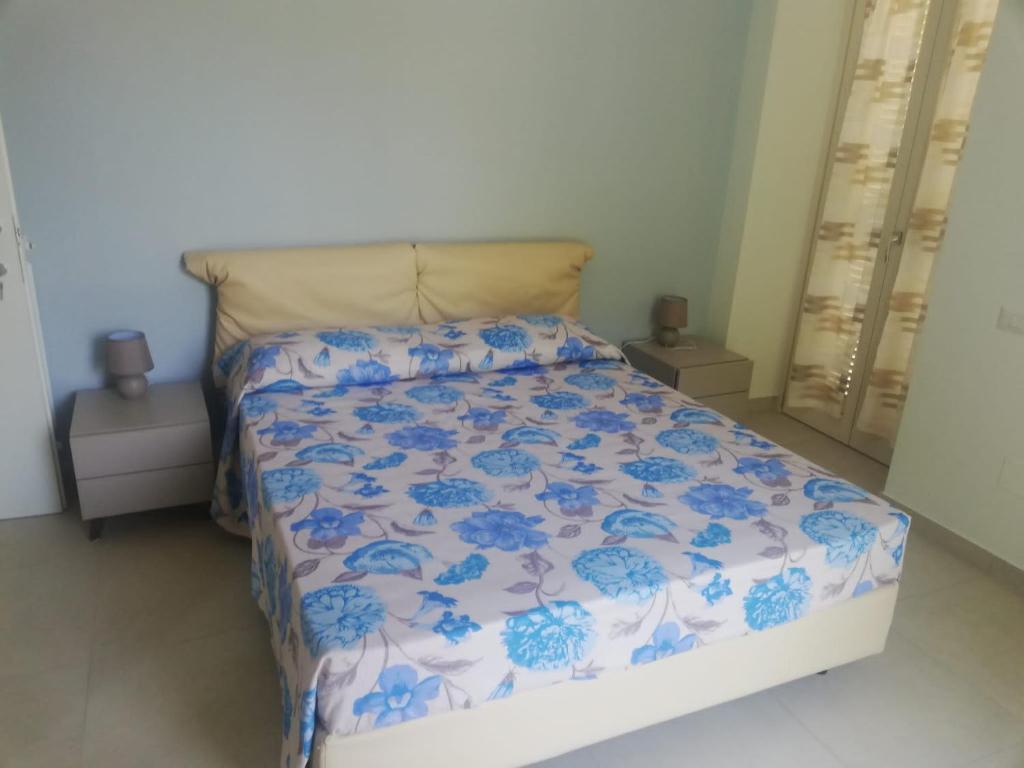 Łóżko lub łóżka w pokoju w obiekcie Villa Maria Cristina d'Amico