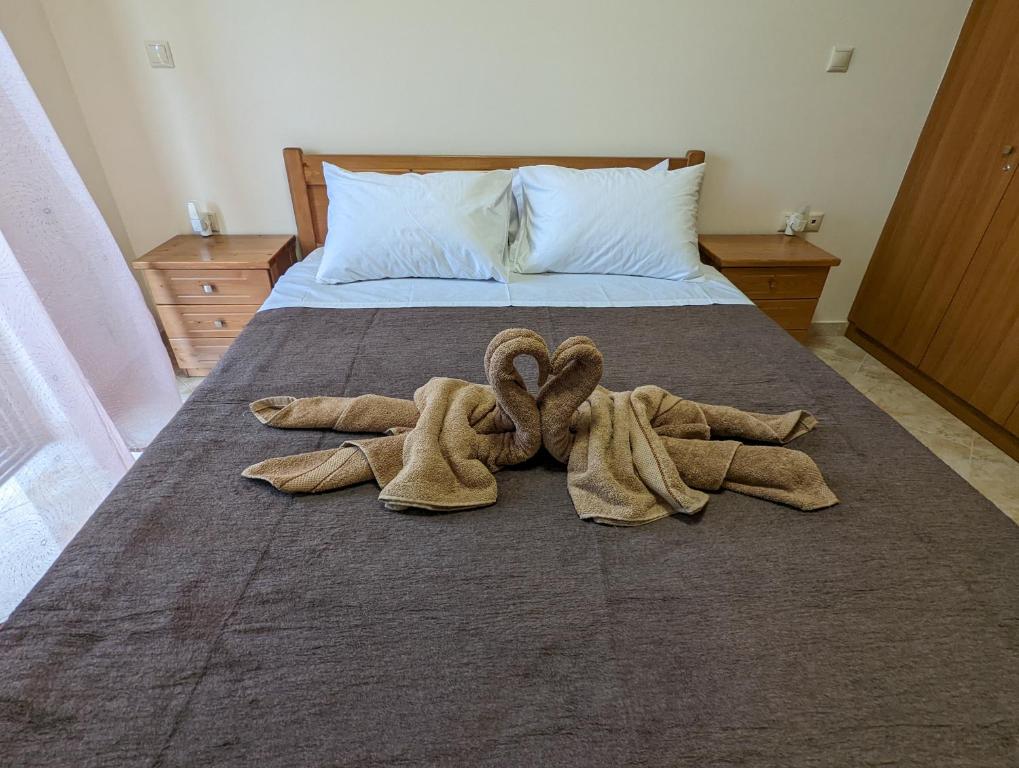 Postel nebo postele na pokoji v ubytování Tharenos home