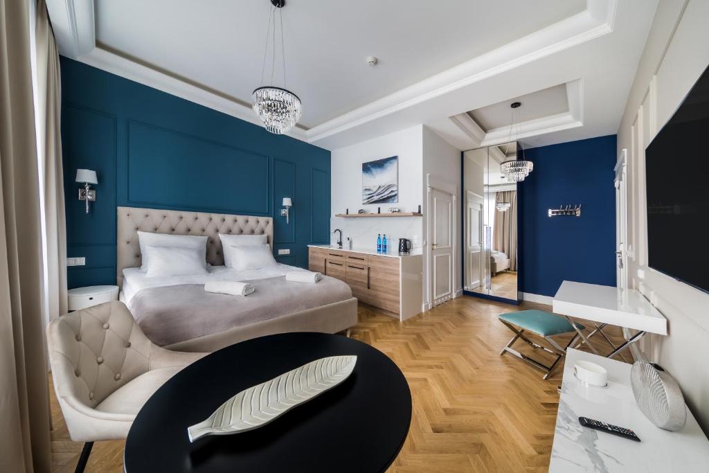 Postel nebo postele na pokoji v ubytování H Aparthotel