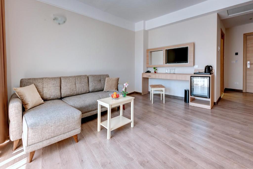 A television and/or entertainment centre at Maria Palace Hotel - All Inclusive