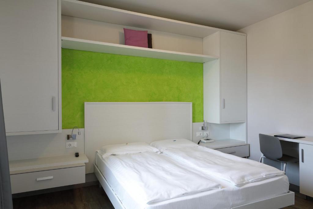 Postel nebo postele na pokoji v ubytování Eco Hotel Benacus