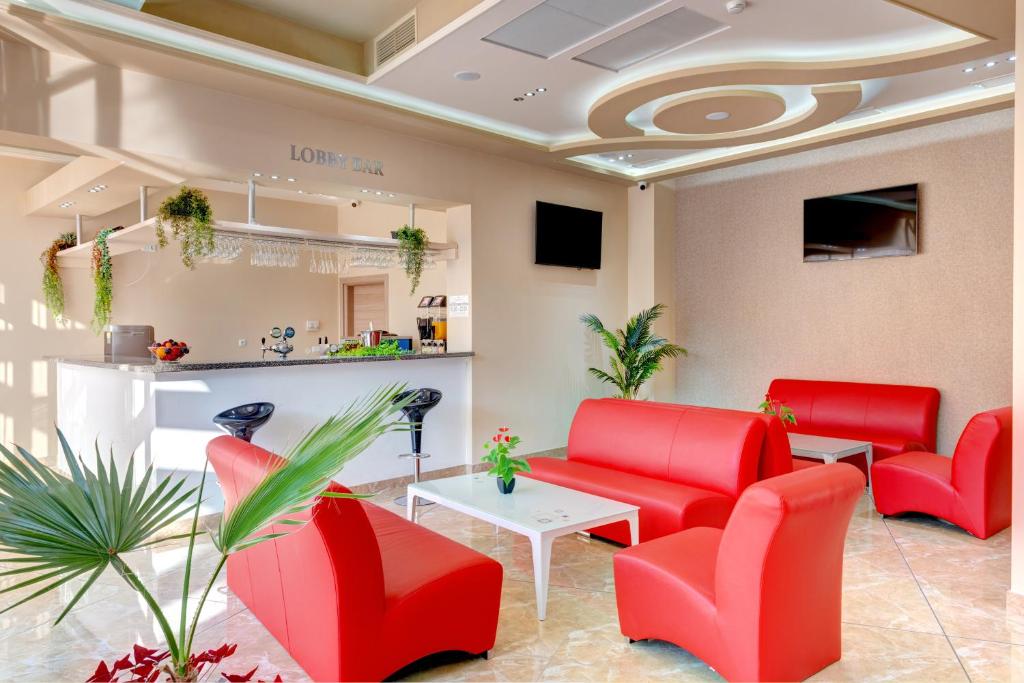 A television and/or entertainment centre at Maria Palace Hotel - All Inclusive