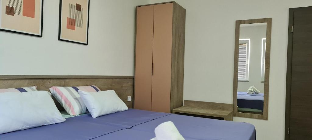 Postel nebo postele na pokoji v ubytování G&G Suites