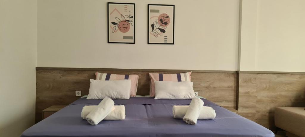 Postel nebo postele na pokoji v ubytování G&G Suites