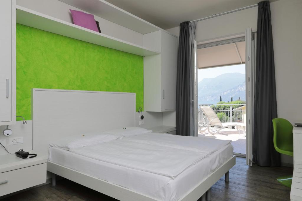 Postel nebo postele na pokoji v ubytování Eco Hotel Benacus