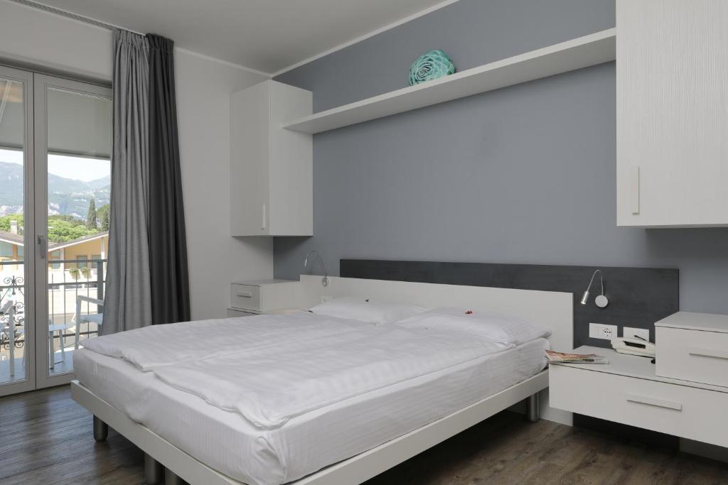 Postel nebo postele na pokoji v ubytování Eco Hotel Benacus