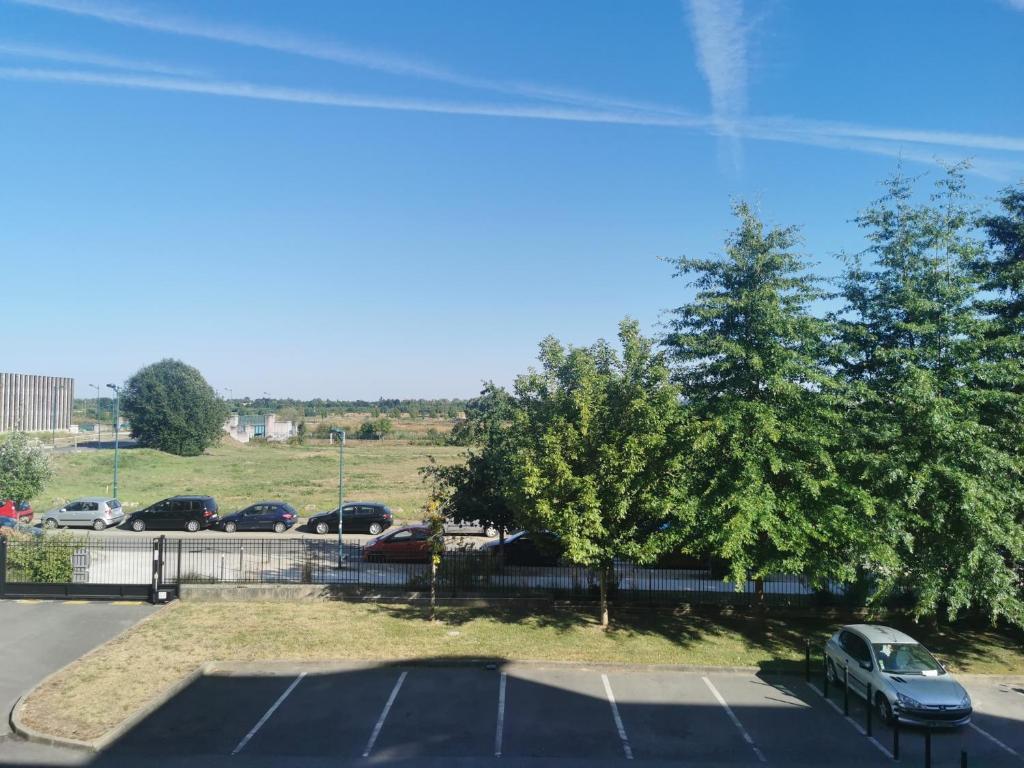 a parking lot with a car parked in it at Escale à Disneyland Paris in Montévrain