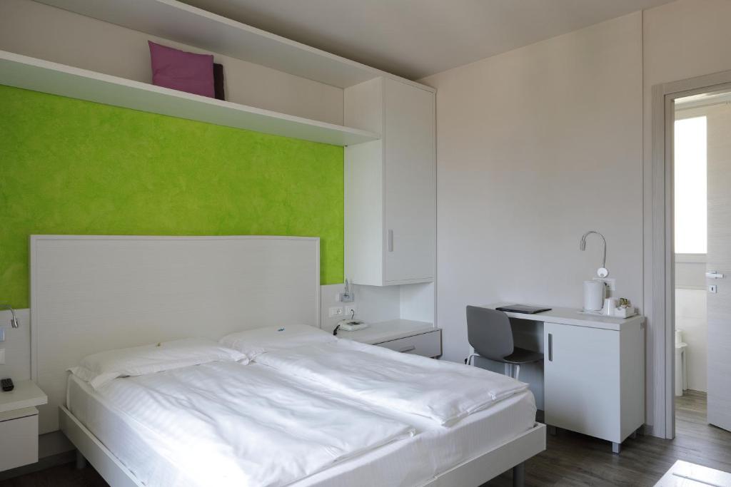Postel nebo postele na pokoji v ubytování Eco Hotel Benacus