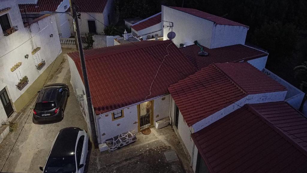 an overhead view of a building with red roofs at Casa Rústica em Alte - KARMEA HOUSES in Alte