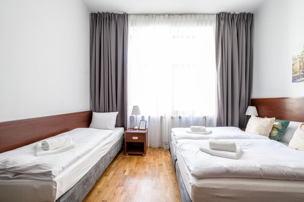 Postel nebo postele na pokoji v ubytování ON/SET APARTHOTEL