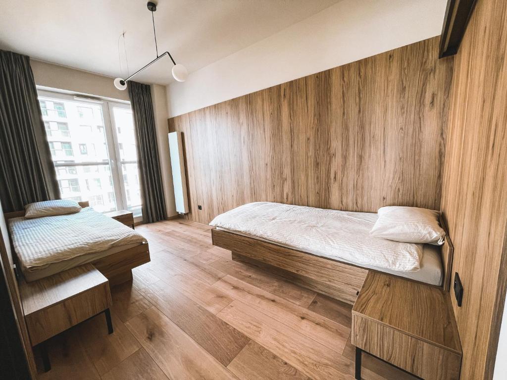 Postel nebo postele na pokoji v ubytování Apartament