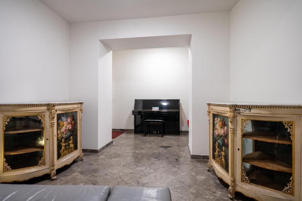 Televízia a/alebo spoločenská miestnosť v ubytovaní Suite Bellini 5 Apartment