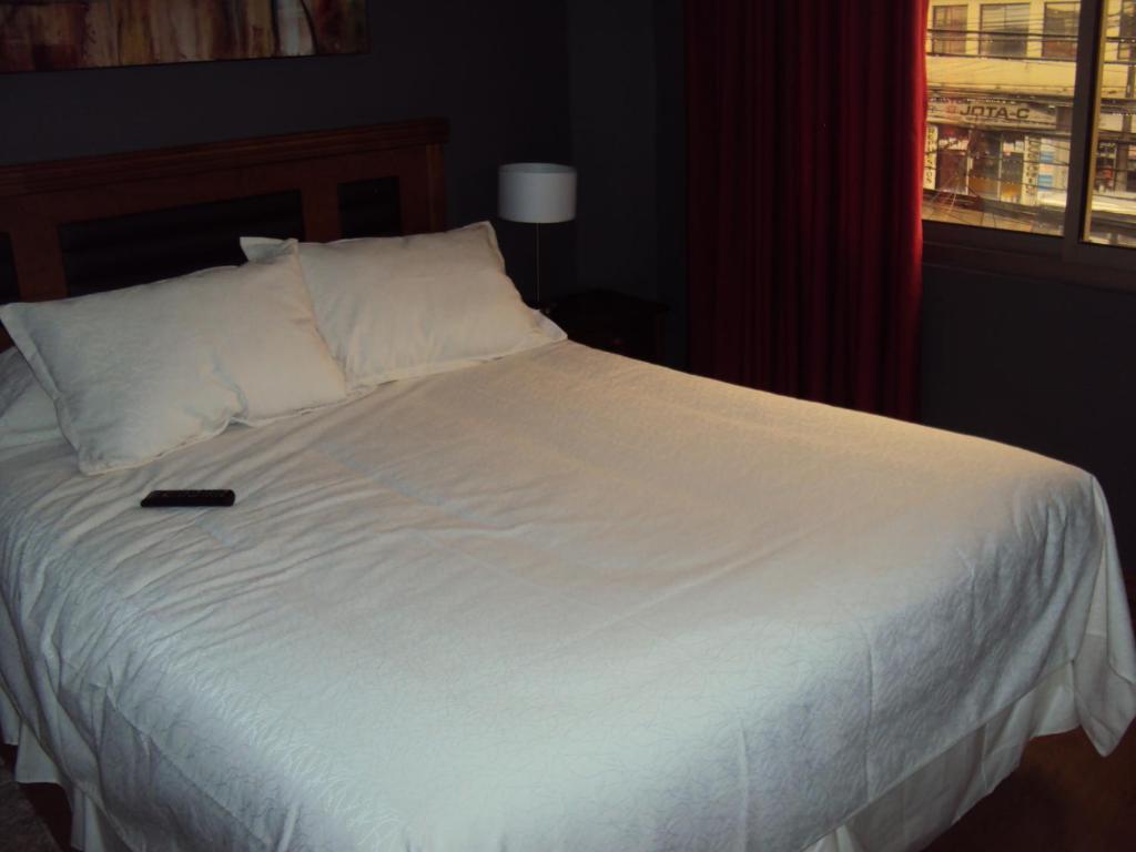 Postel nebo postele na pokoji v ubytování Apart Hotel Cancura