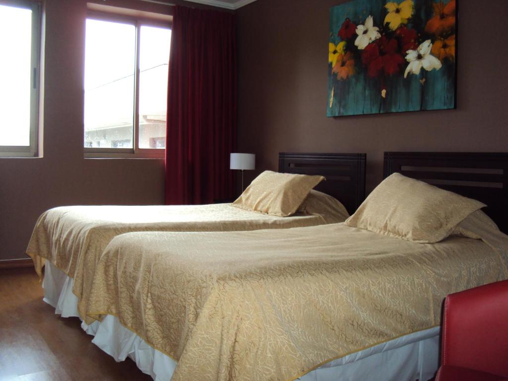 Postel nebo postele na pokoji v ubytování Apart Hotel Cancura