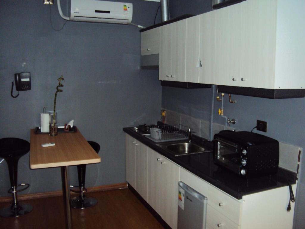 Kuchyň nebo kuchyňský kout v ubytování Apart Hotel Cancura