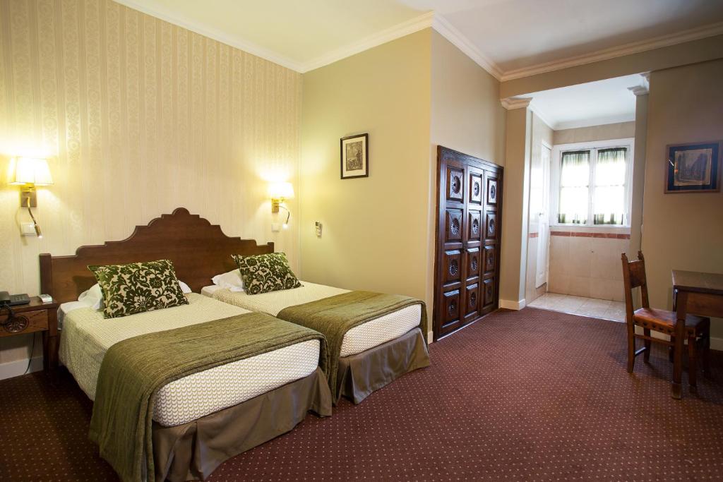 Кровать или кровати в номере Hotel Dom Sancho I