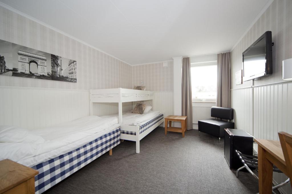 TV a/nebo společenská místnost v ubytování Lages Motel