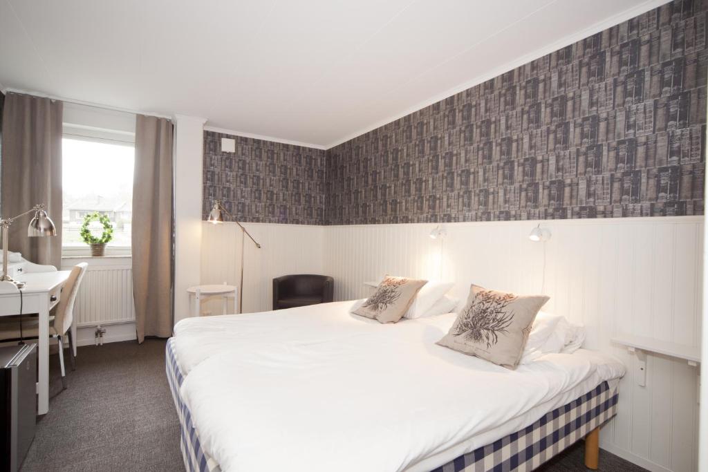 Postel nebo postele na pokoji v ubytování Lages Motel