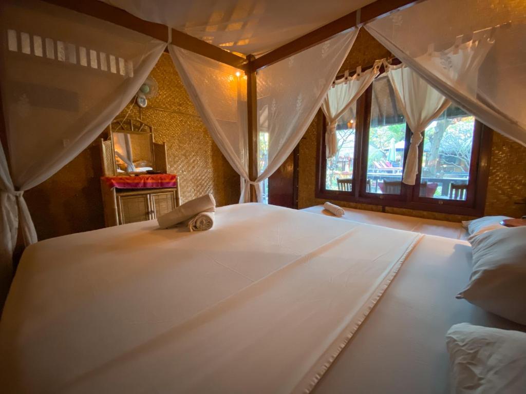 Letto o letti in una camera di Sejuk Cottages