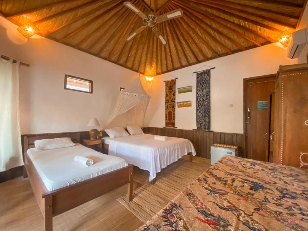 Letto o letti in una camera di Sejuk Cottages