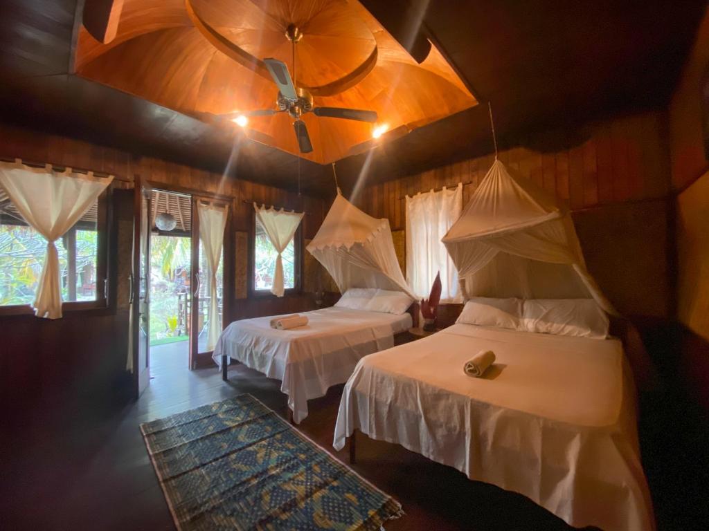 Letto o letti in una camera di Sejuk Cottages