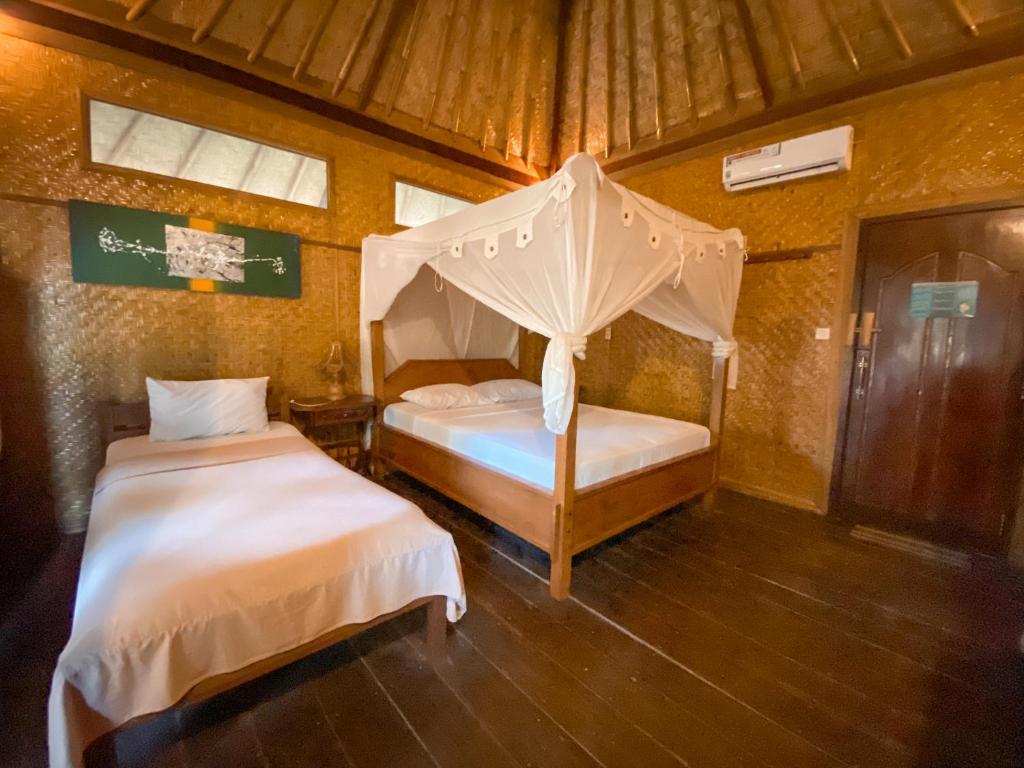 Letto o letti in una camera di Sejuk Cottages